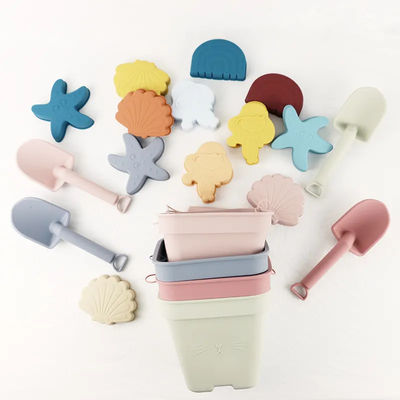 Les jouets adaptés aux besoins du client de silicone de bébé, seau de sable de silicone ont placé avec 6 morceaux