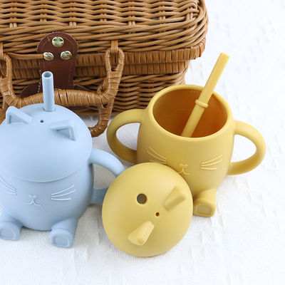Les enfants portatifs de silicone de catégorie comestible mettent en forme de tasse Cat Style For Infant Training non toxique