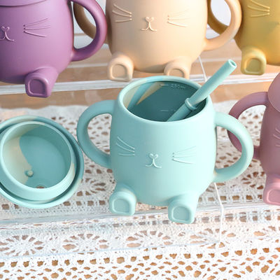 Les enfants portatifs de silicone de catégorie comestible mettent en forme de tasse Cat Style For Infant Training non toxique