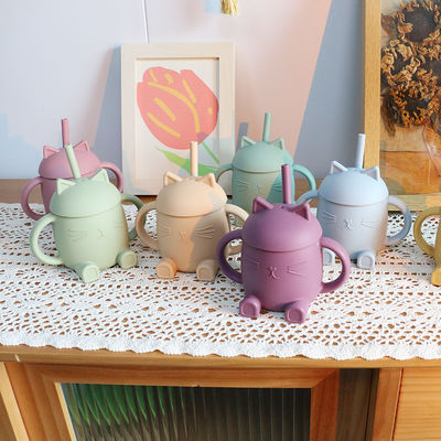 Les enfants portatifs de silicone de catégorie comestible mettent en forme de tasse Cat Style For Infant Training non toxique