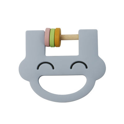 Le hochet mignon Teether de silicone de jouets d'enfants de silicone de visage de sourire avec adaptent l'ODM aux besoins du client d'OEM de logo
